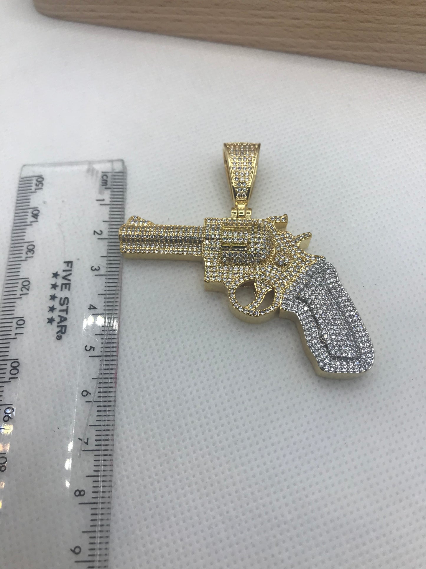 iced out gun pendant