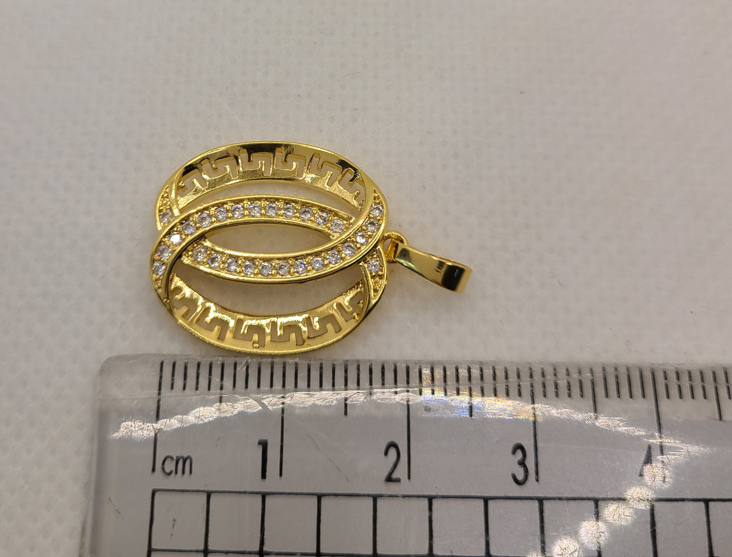 Gold pated versace design pendants