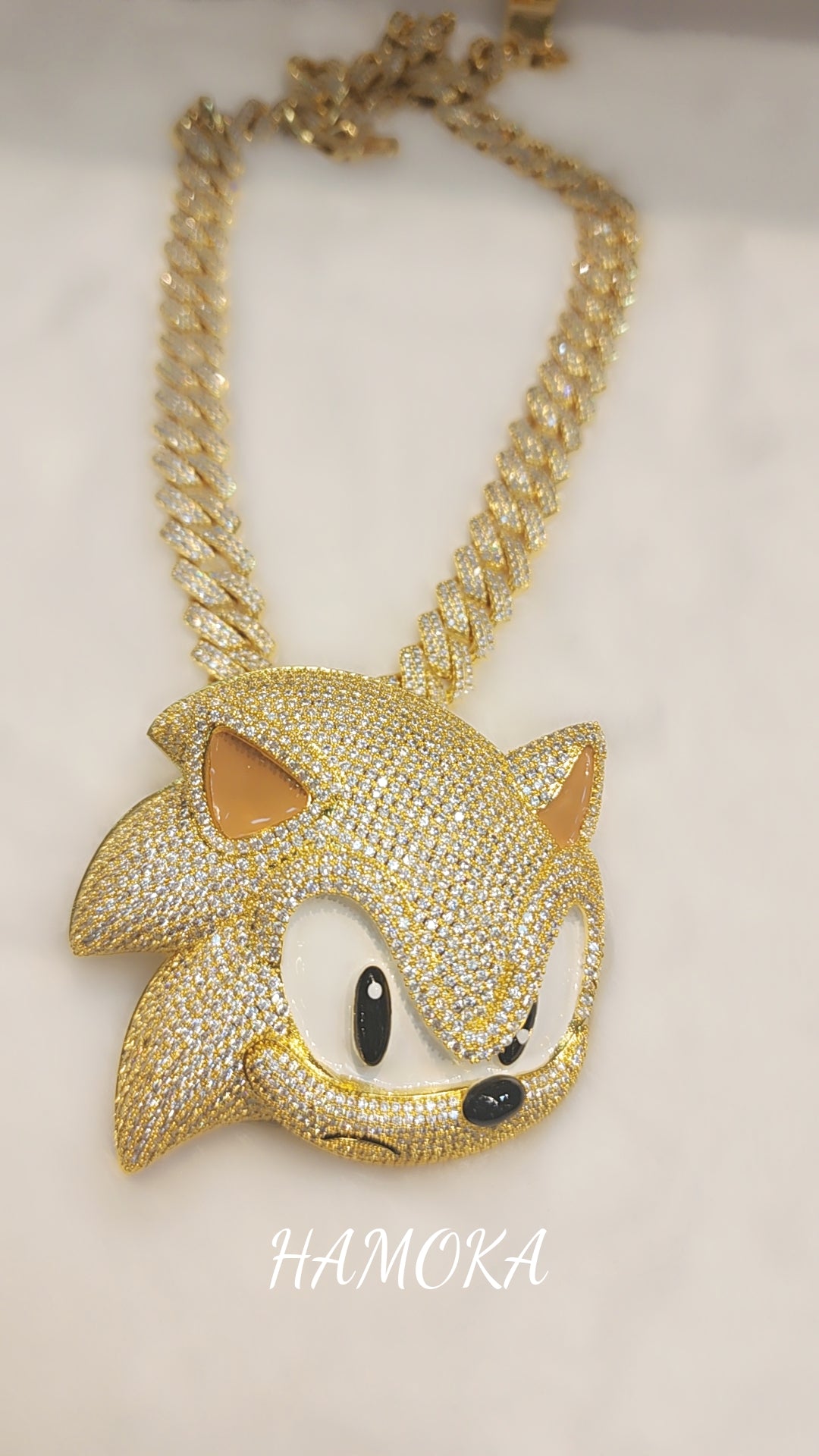 Iced out gold plated sonic pendant
