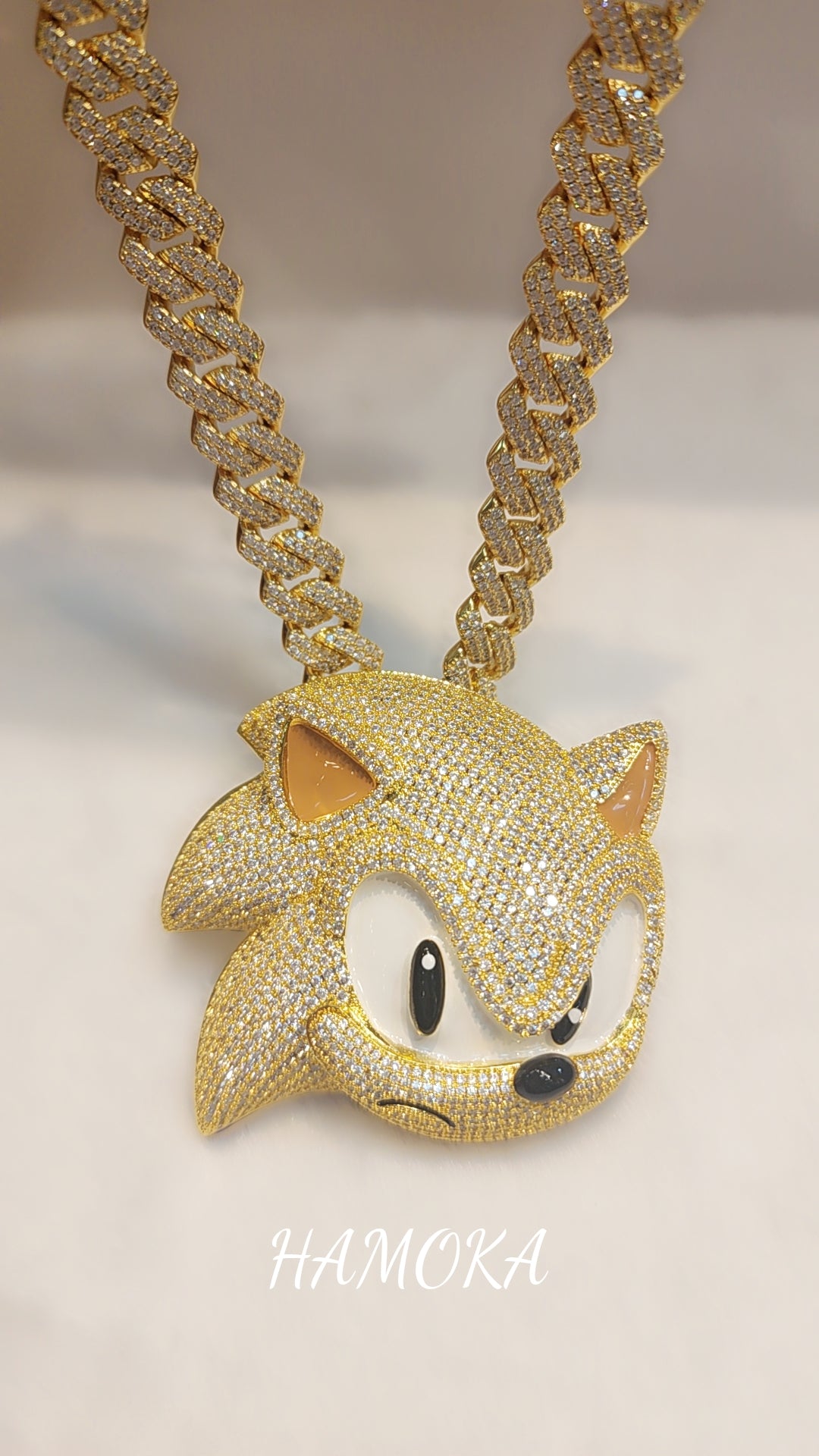 Iced out gold plated sonic pendant