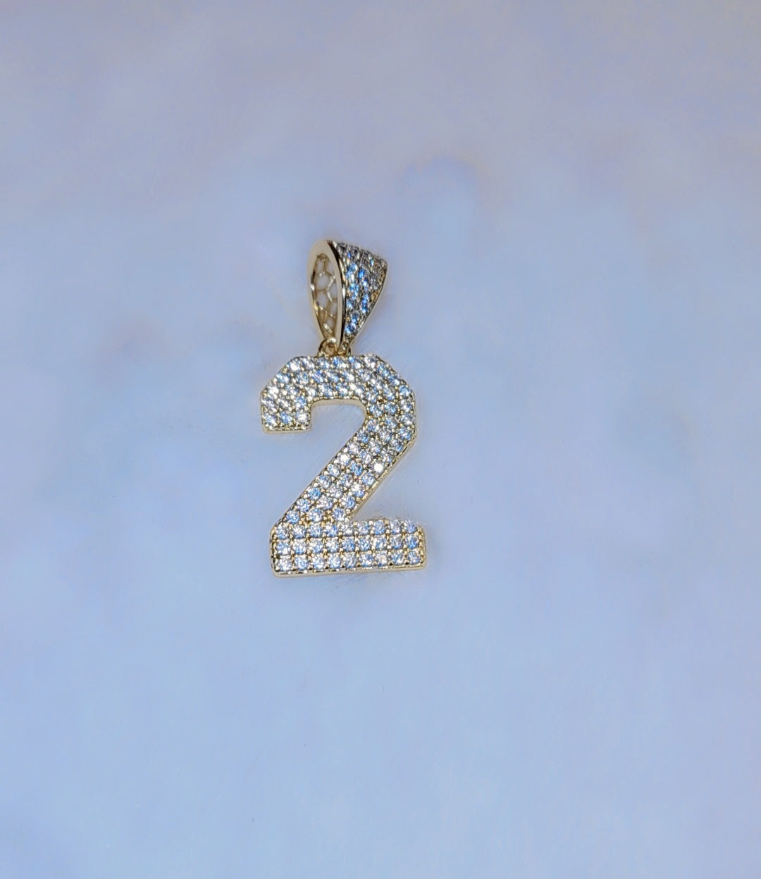 Iced out gold plated Number pendant