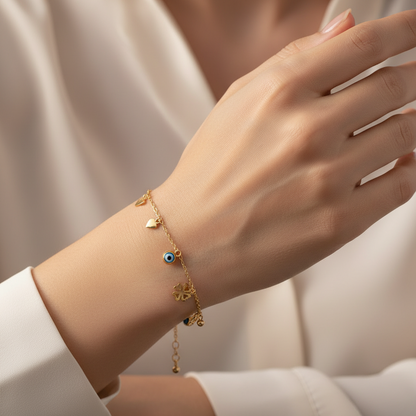 10KT Gold, multi charms bracelet with anchor link  6.5″ + 0.5″ + 0.5″ extension (1mm)